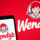 phone displaying wendy's logo